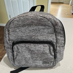 Pink brand mini backpack purse.